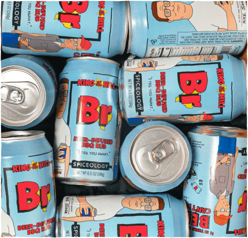 Multiple Spiceology King of the Hill Beer Infused BBQ Rub branded spice cans grouped together on a white background