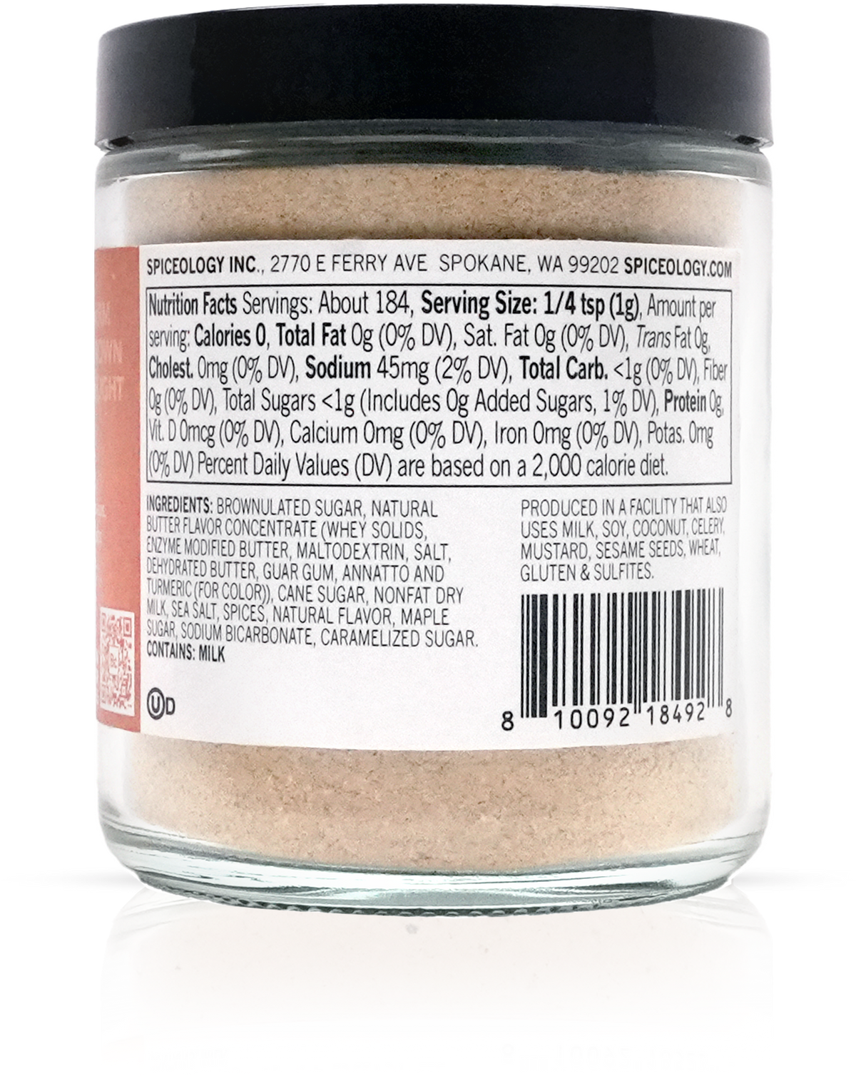 Glass jar with black lid containing a light brown powder, showing nutritional information on a white background.